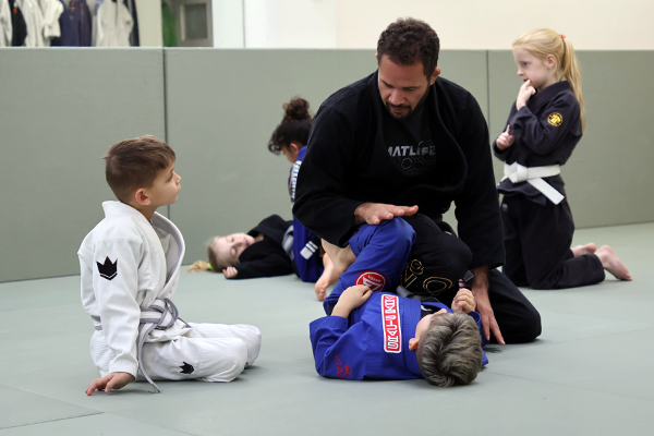 Expert instructor guiding young athletes - Expert Guidance