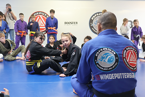 Young BJJ athletes training hard - The Grind
